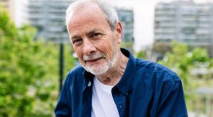 Happy,Senior,Man,With,Grey,Hair,And,Beard,Smiling,At