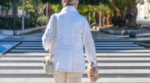 Rear,View,Of,A,Casually,Dressed,Gray-haired,Senior,Woman,Crossing