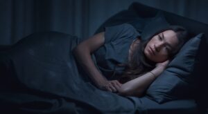 Sad,Pensive,Woman,Lying,In,Bed,At,Night,,She,Is
