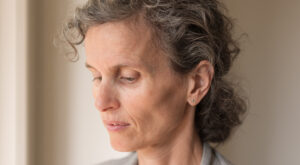 Close,Up,Side,View,Of,Middle,Aged,Woman,With,Grey