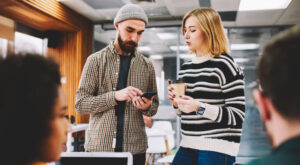 Two,Hipster,Students,Discussing,New,Application,During,Coffee,Break,For