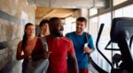 Happy,Athletic,Friends,Going,To,Exercise,Class,In,Health,Club.