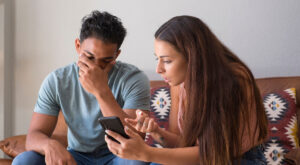 Infidelity.,Jealous,Girlfriend,Showing,His,Cheating,Boyfriend,His,Phone,Demanding