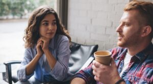 Young,Couple,Drinking,Coffee,In,Cafe